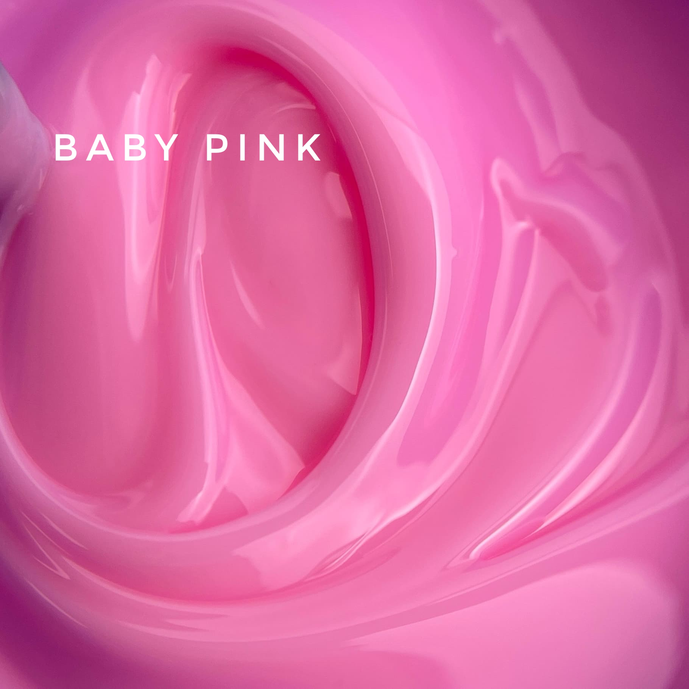 Glossy baby pink UV gel for nails, smooth creamy manicure product texture
