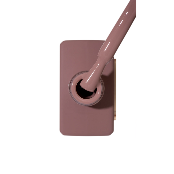 Brown rose gel nail polish bottle with applicator brush, perfect for manicures