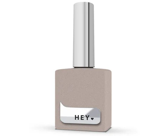 Beige professional nail polish bottle with silver cap, labeled HEY, for manicure use