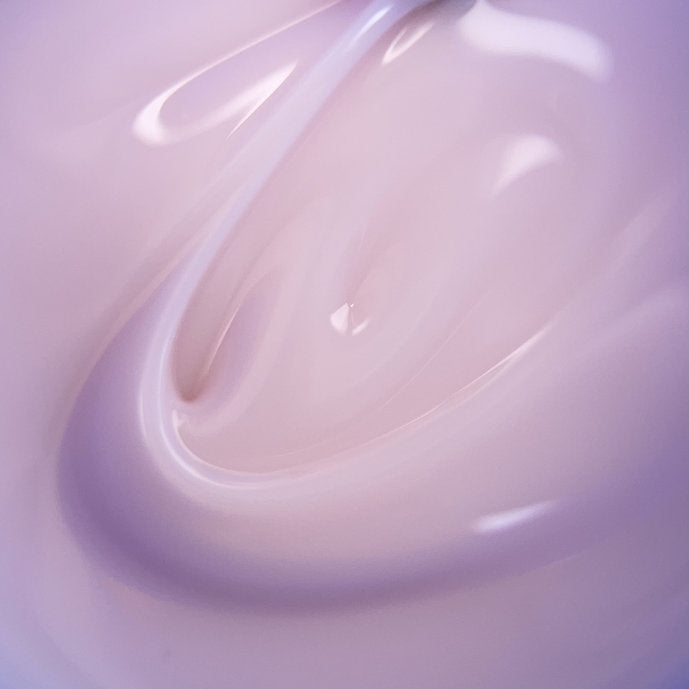 Swirl of light pink UV gel nail polish, creamy texture for professional manicure