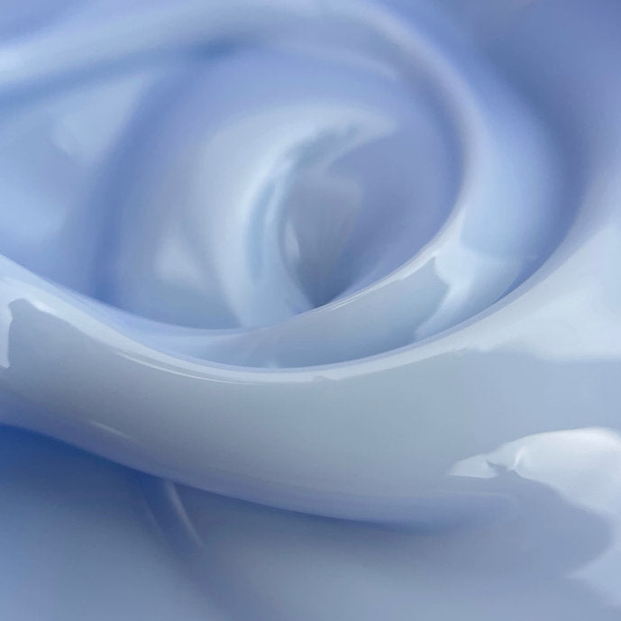 Close-up of light blue builder gel with smooth, glossy texture for professional nail art