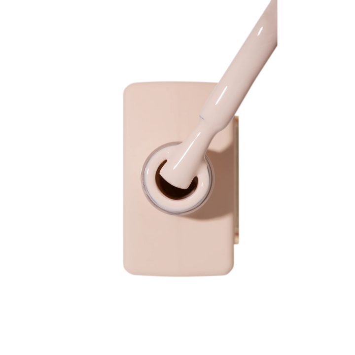 Beige nude nail polish bottle with brush, ideal for manicure and pedicure