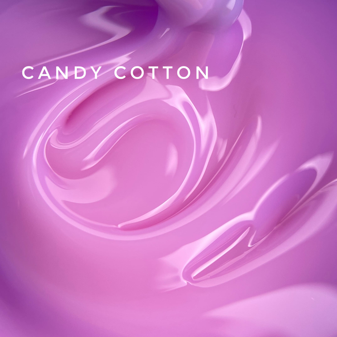 Swirled glossy pastel pink UV gel for nails with 'Candy Cotton' text, manicure product closeup