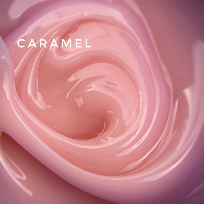 Close-up of creamy caramel pink UV nail gel with glossy texture, perfect for manicures.