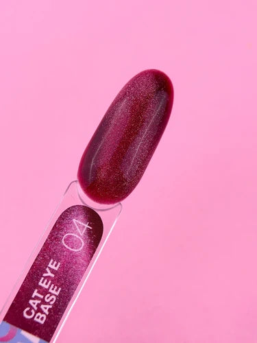 Cat eye gel polish swatch in metallic magenta shade 04 on clear nail sample, pink background