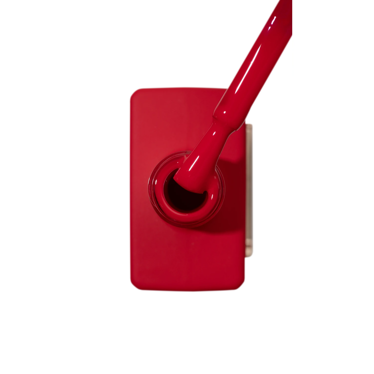 Red gel nail polish bottle with brush, professional manicure product