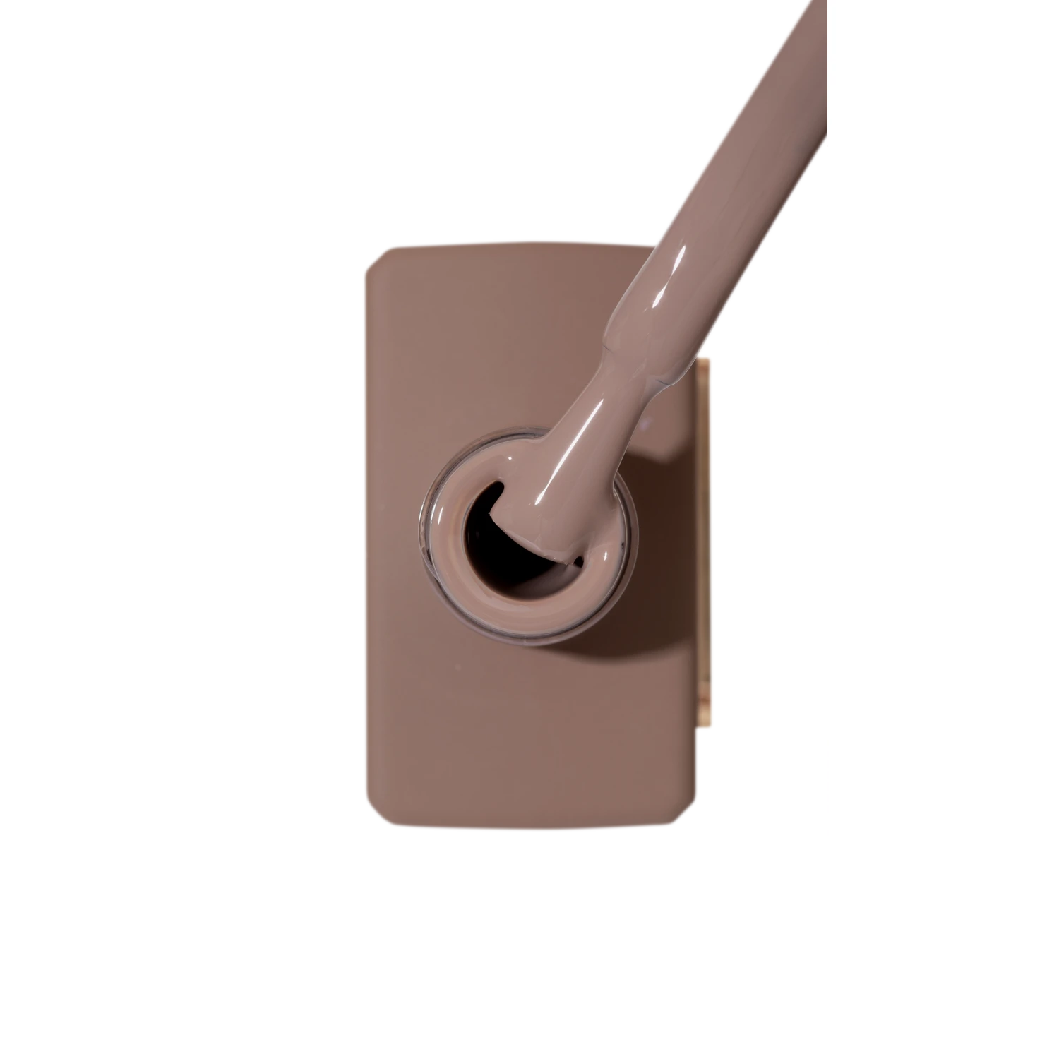 Beige nude gel nail polish bottle with brush for manicure