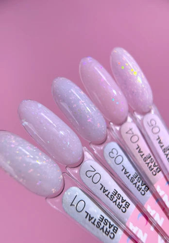 Pink and white glitter nail gel color swatches on display sticks for manicure.