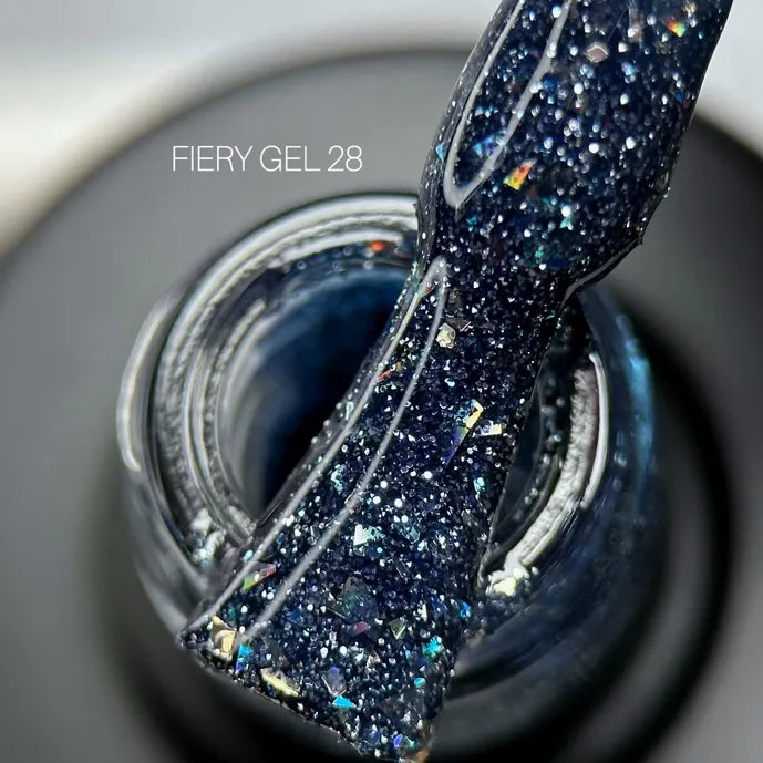 Close-up of dark blue glitter gel nail polish with sparkles, labeled Fiery Gel 28
