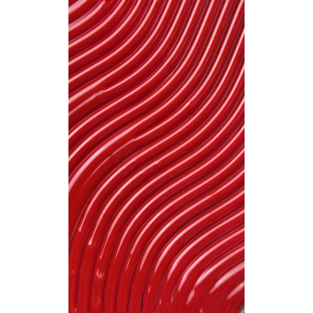 Close-up of glossy red wavy nail polish texture for manicure or pedicure