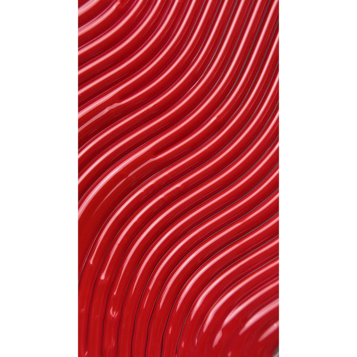 Close-up of glossy red wavy nail polish texture for manicure or pedicure