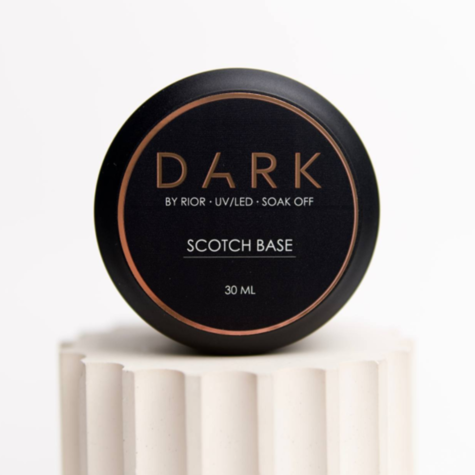 Black round container of DARK Scotch Base UV/LED soak off nail gel, 30ml, on white pedestal.