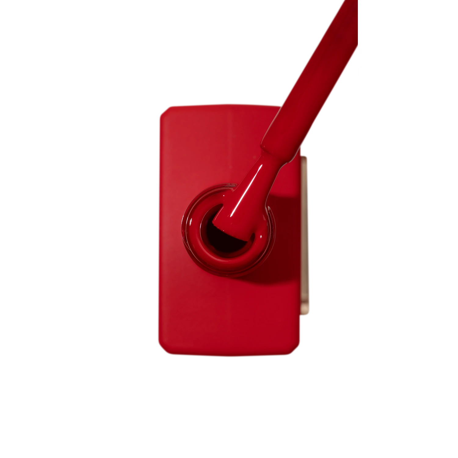 Red gel nail polish bottle with brush, professional manicure product