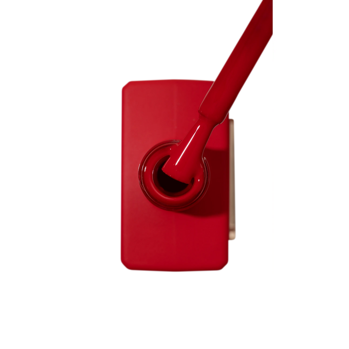 Red gel nail polish bottle with brush, professional manicure product