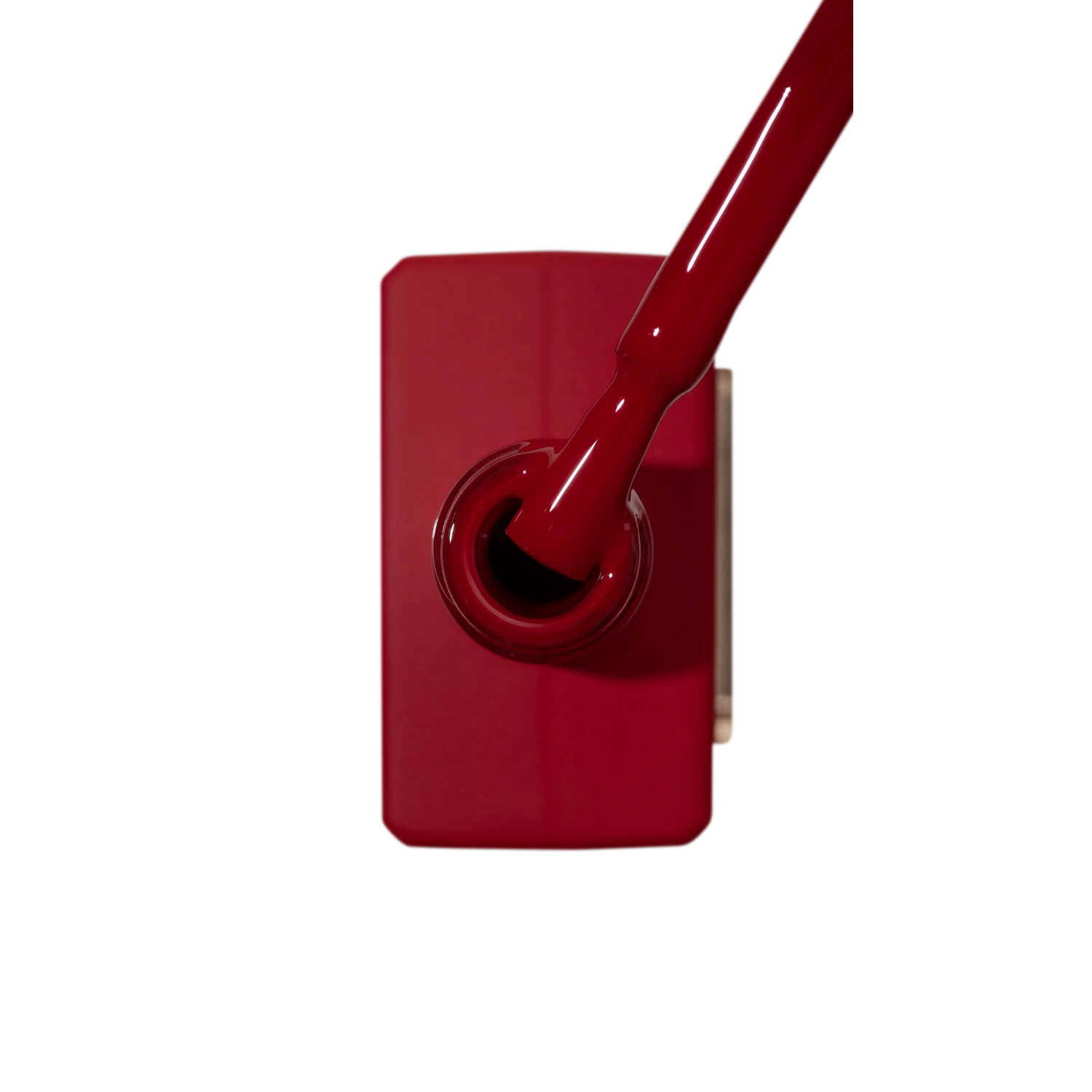 Red gel nail polish bottle with brush, professional manicure accessory