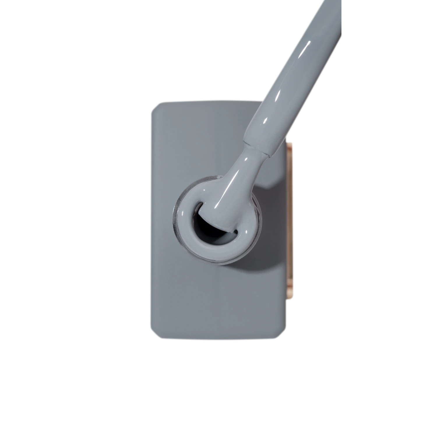 Grey nail polish bottle with brush applicator for manicure and pedicure