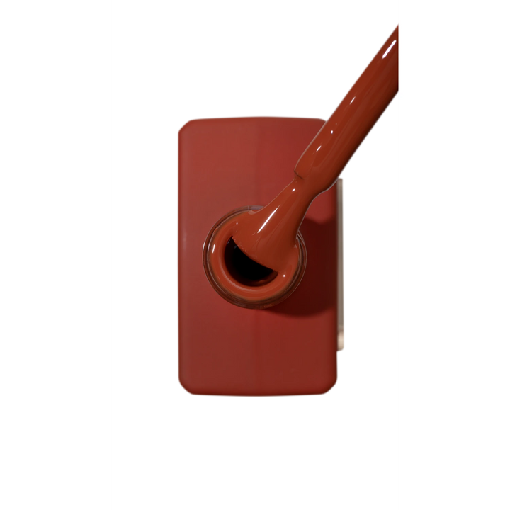 Rich brown nail polish bottle with brush, professional manicure UV gel