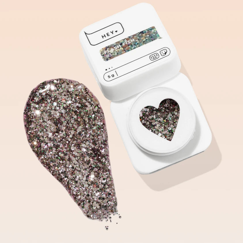 Glittery silver UV gel nail polish in white container with heart-shaped window