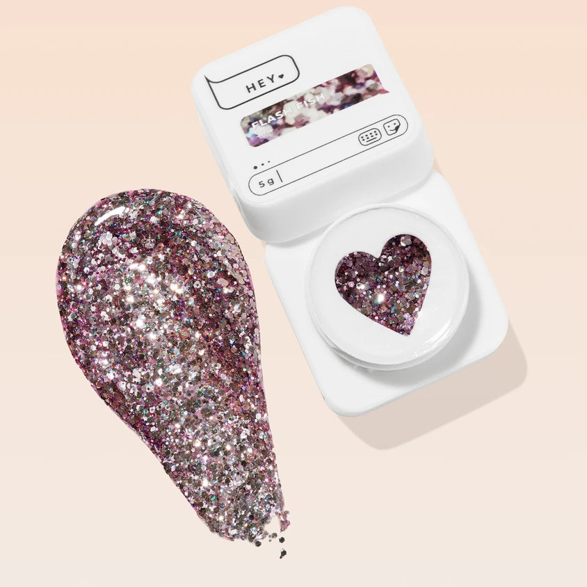 Sparkling rose gold glitter UV gel nail polish in white heart-shaped container