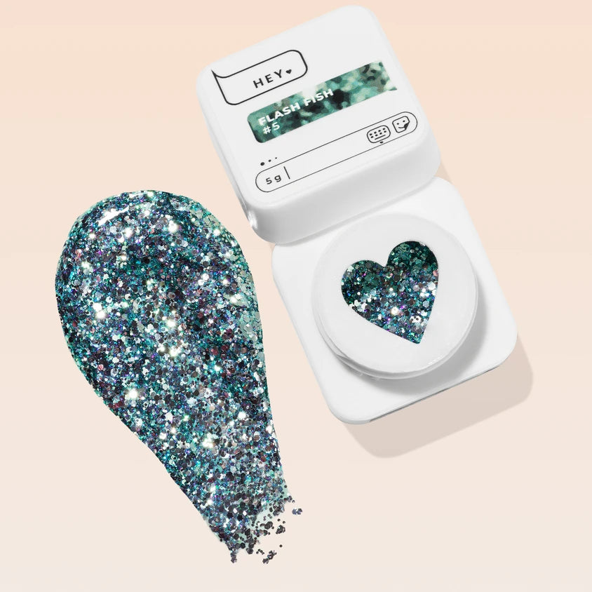Silver and teal chunky glitter gel polish in open container for nail art and manicure