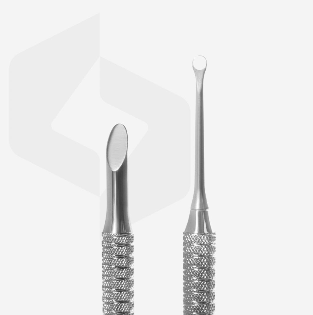 Stainless steel dual-ended nail cuticle pusher and cleaner on white background