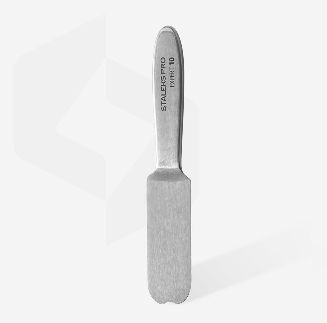 Stainless steel pedicure foot file for callus removal on white background