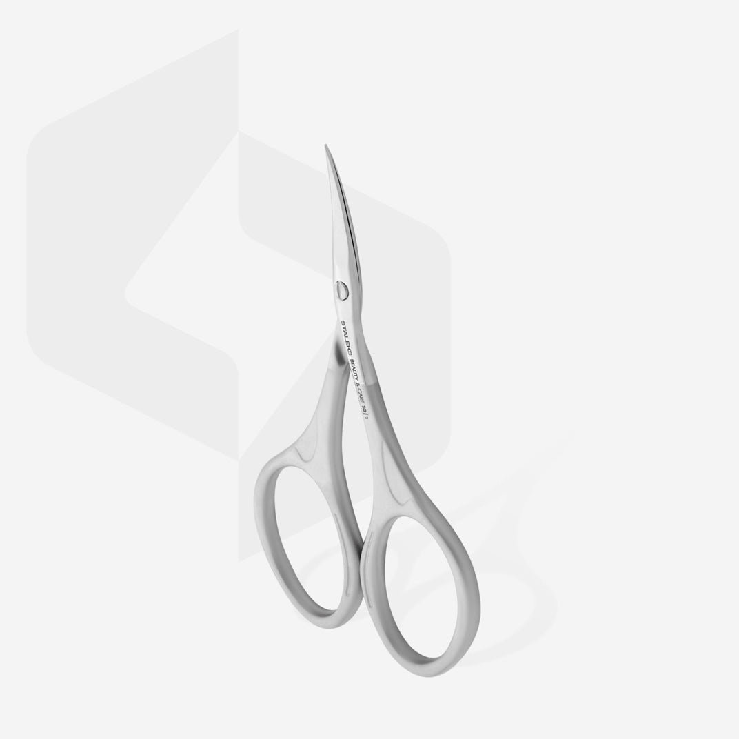 Curved stainless steel manicure scissors for nail and cuticle care on white background
