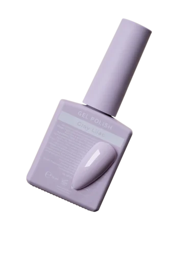Gray lilac UV gel polish bottle with color sample for manicure