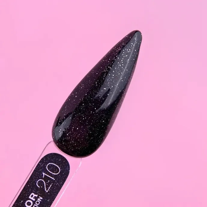 Black glitter gel nail polish swatch with glossy finish on a pink background