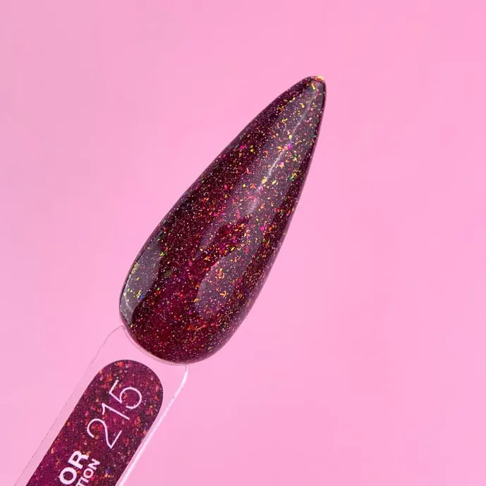 Burgundy glitter gel nail polish swatch with iridescent flakes on a sample stick, pink background.