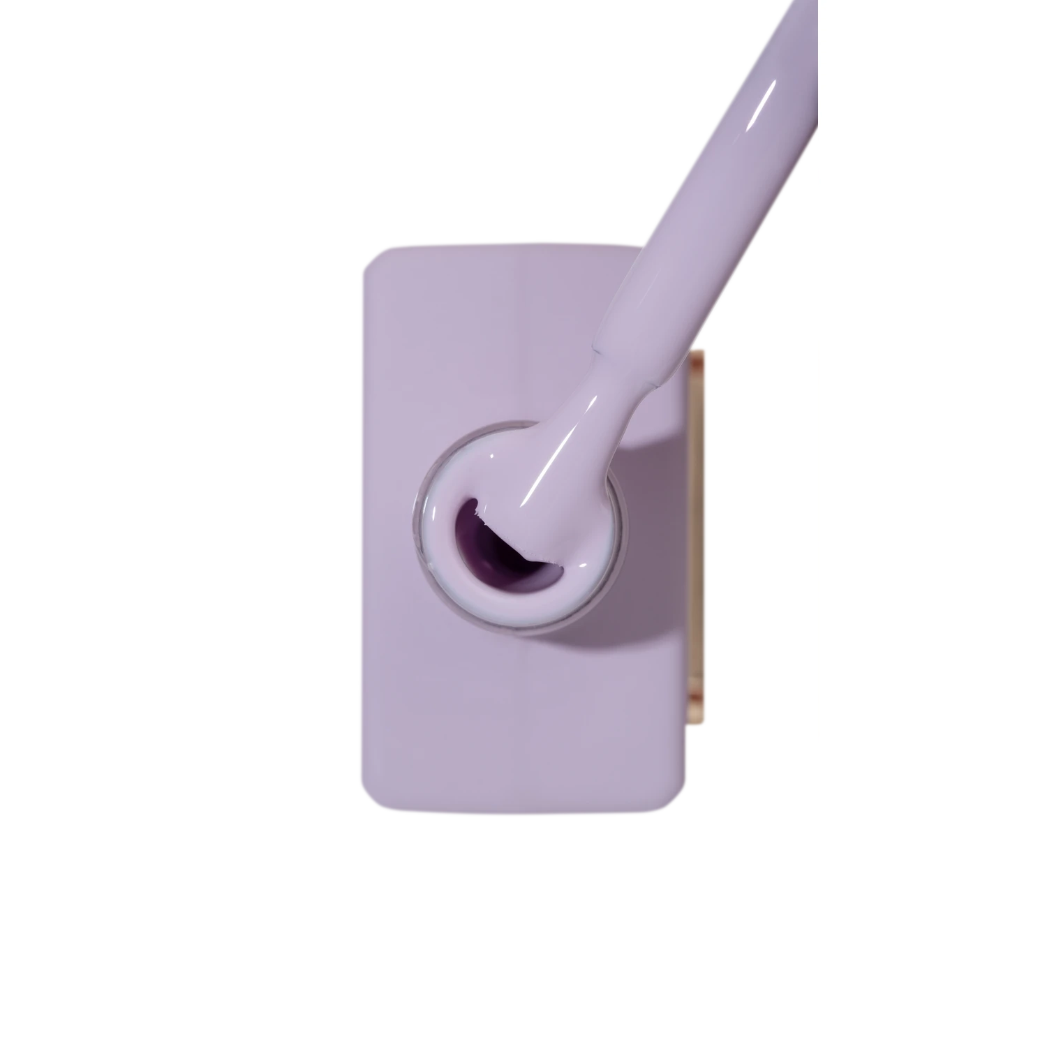 Open bottle of gray lilac gel nail polish with brush, viewed from above
