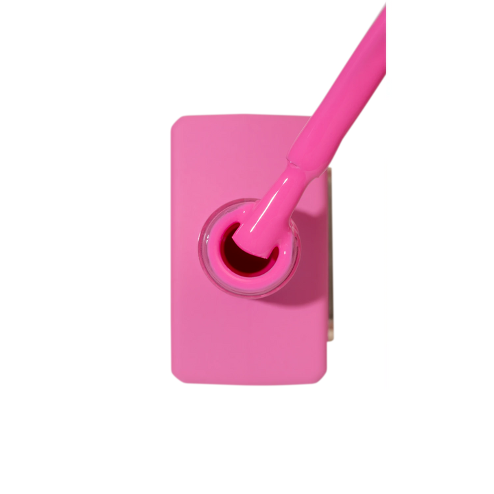 Bright pink nail polish bottle with brush, ideal for manicures and nail art