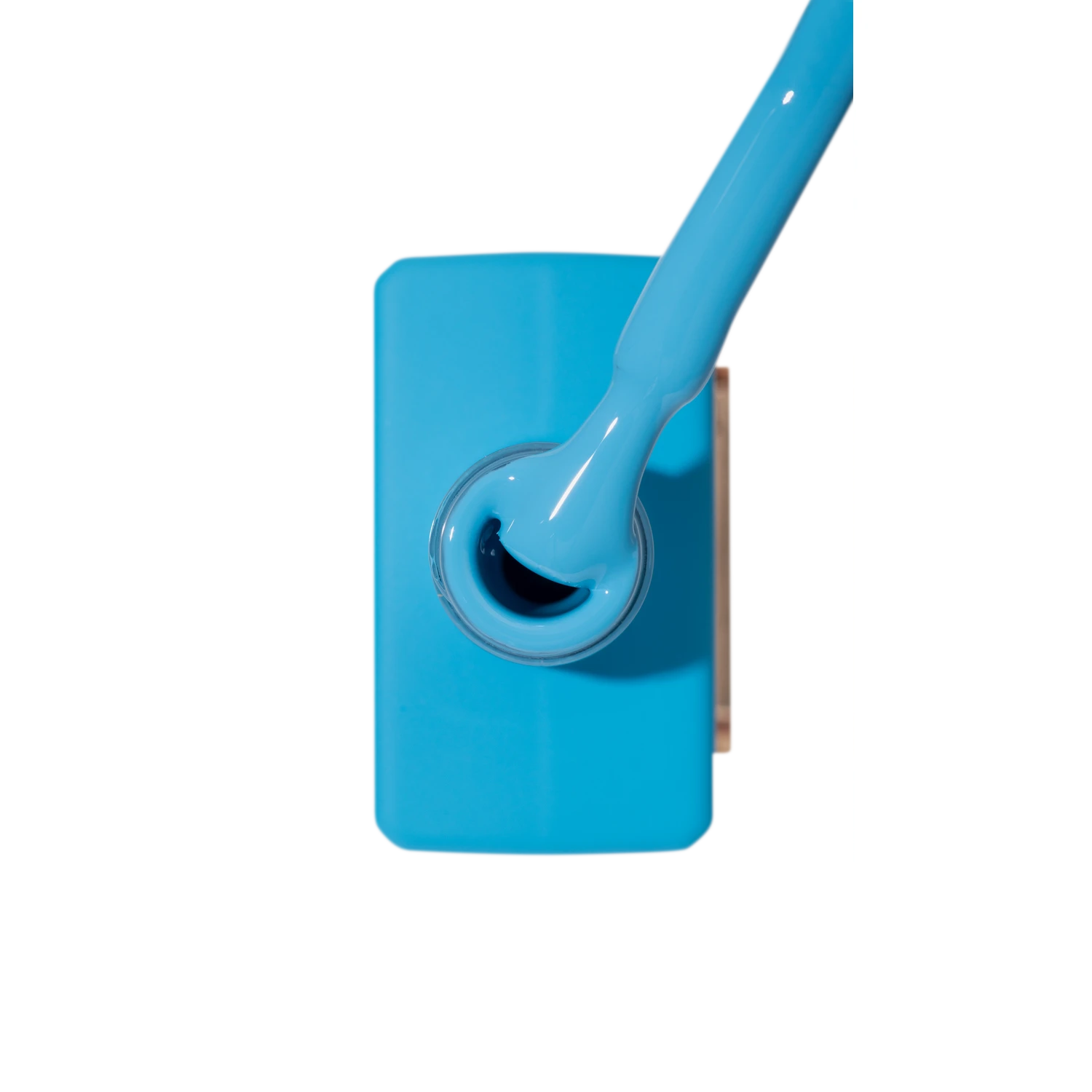 Bright blue nail polish bottle with applicator brush, professional manicure product
