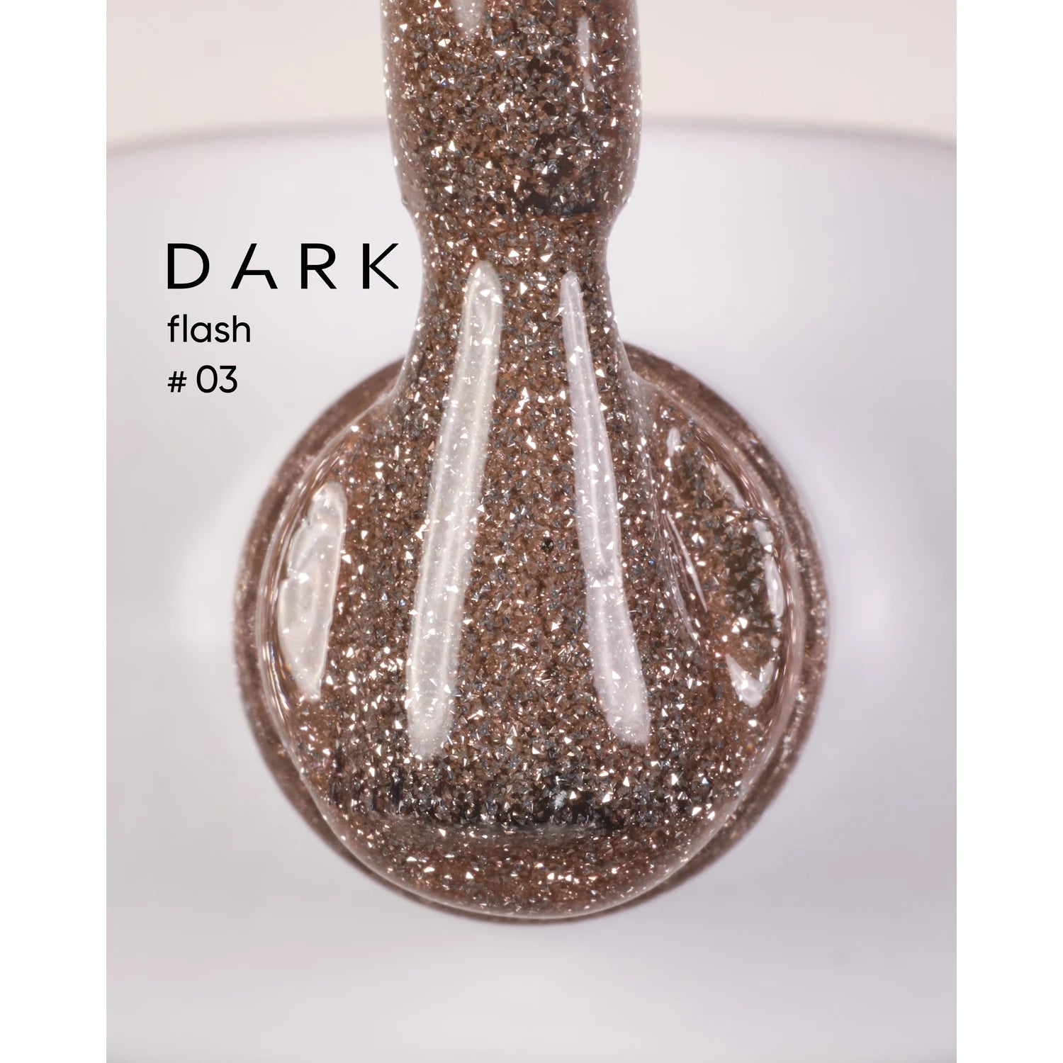 Close-up of brown glitter gel nail polish brush, labeled Dark Flash #03, in clear dish.