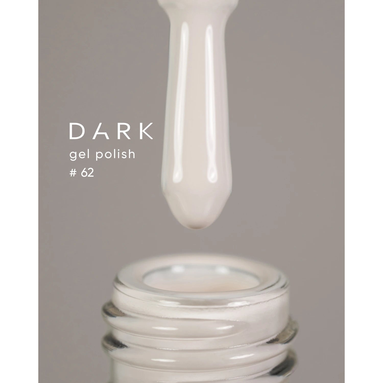 Beige gel polish being dispensed from brush into bottle, labeled dark gel polish #62