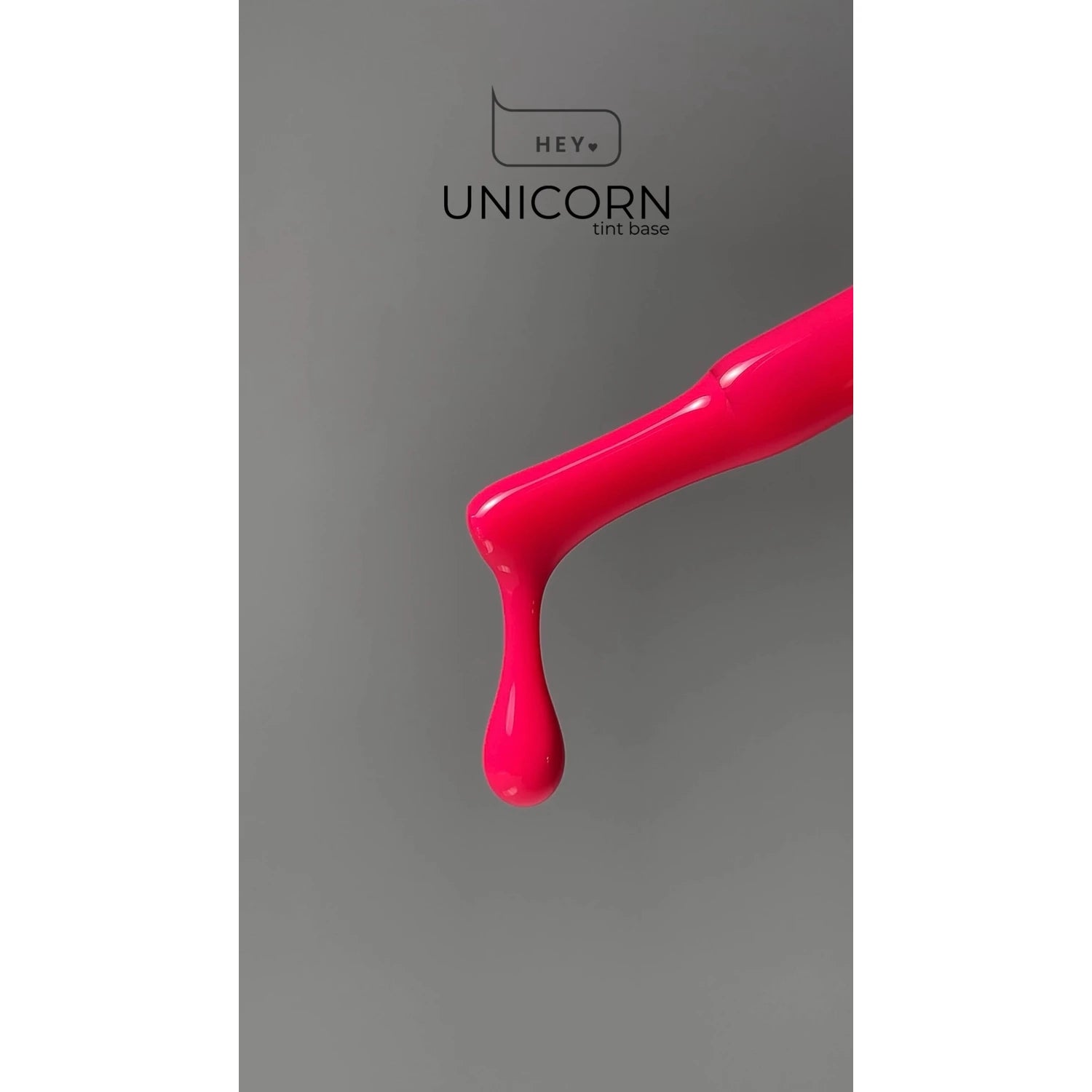 Bright pink gel polish drop on brush, nail product for manicure, grey background