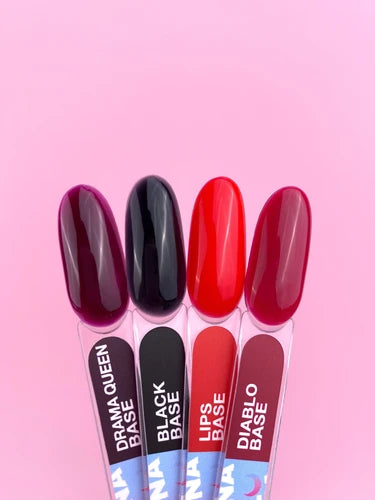 Four nail polish color samples in burgundy, black, red, and deep red on a pink background