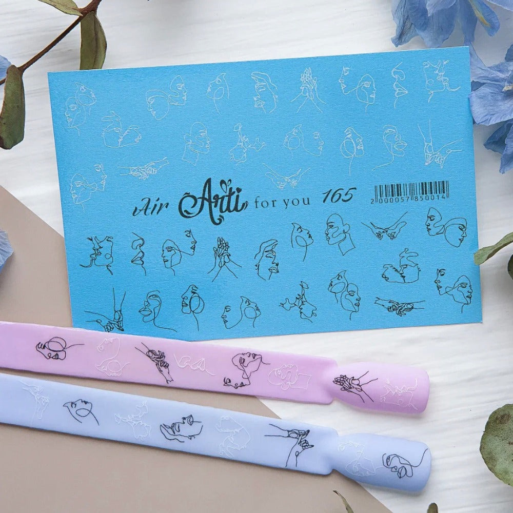 Nail art sticker set with abstract face line designs on blue card, shown on pastel nail swatches.