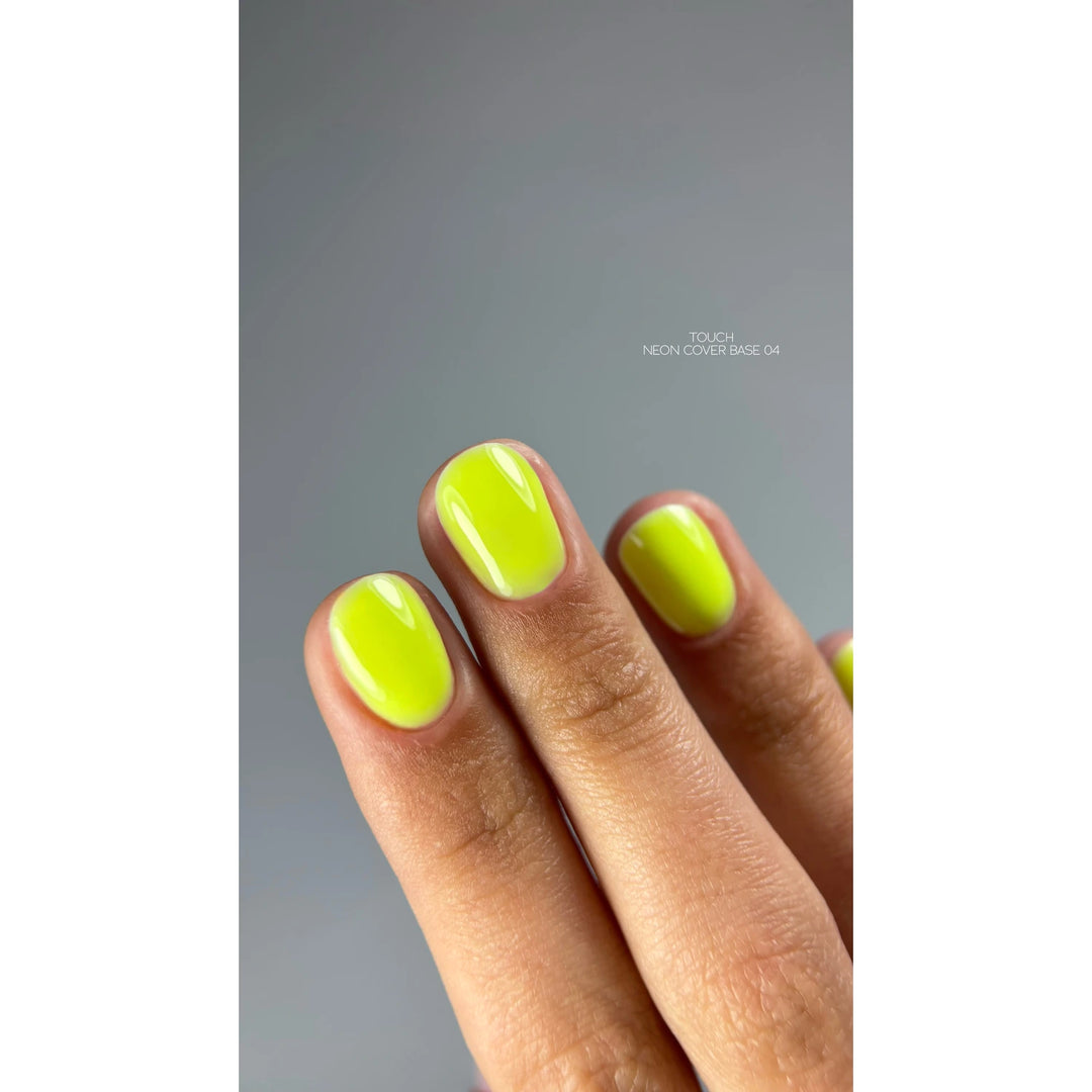 Hand with short nails painted neon yellow UV gel polish, manicure close-up