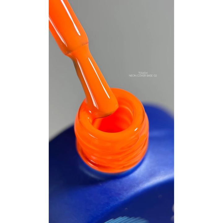 Neon orange gel nail polish brush and bottle, professional manicure product