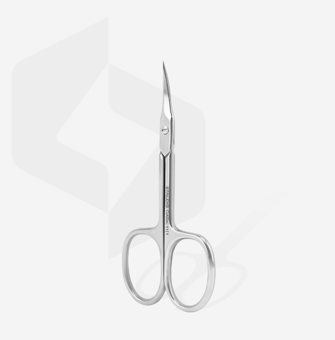 Stainless steel cuticle scissors for manicure and nail care on white background