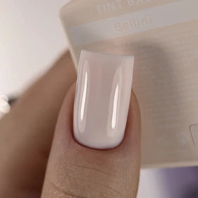 Close-up of a manicured fingernail with glossy nude pink gel polish