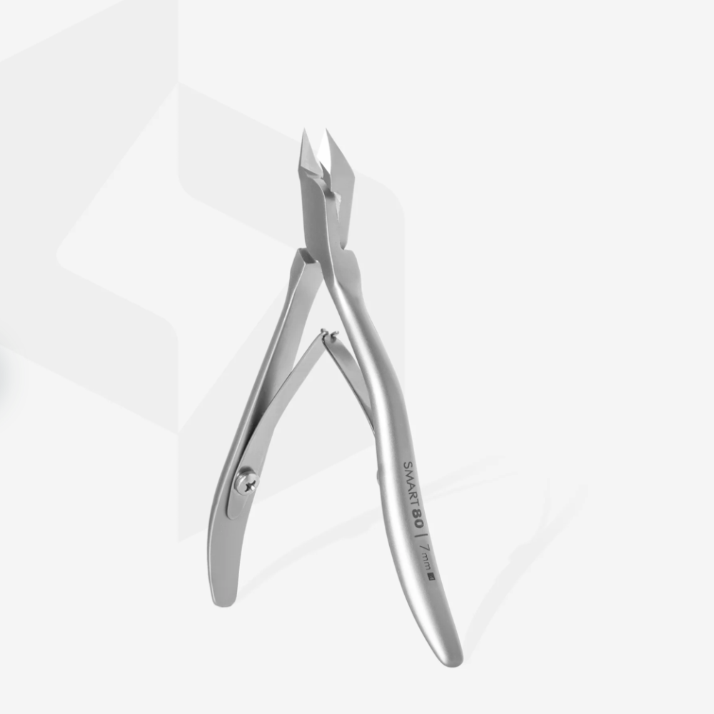 Stainless steel cuticle nipper for manicure and nail grooming on white background