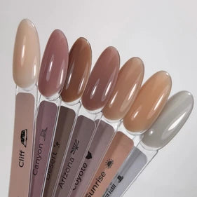 Set of nude and earthy gel nail polish swatches for manicure on sample sticks