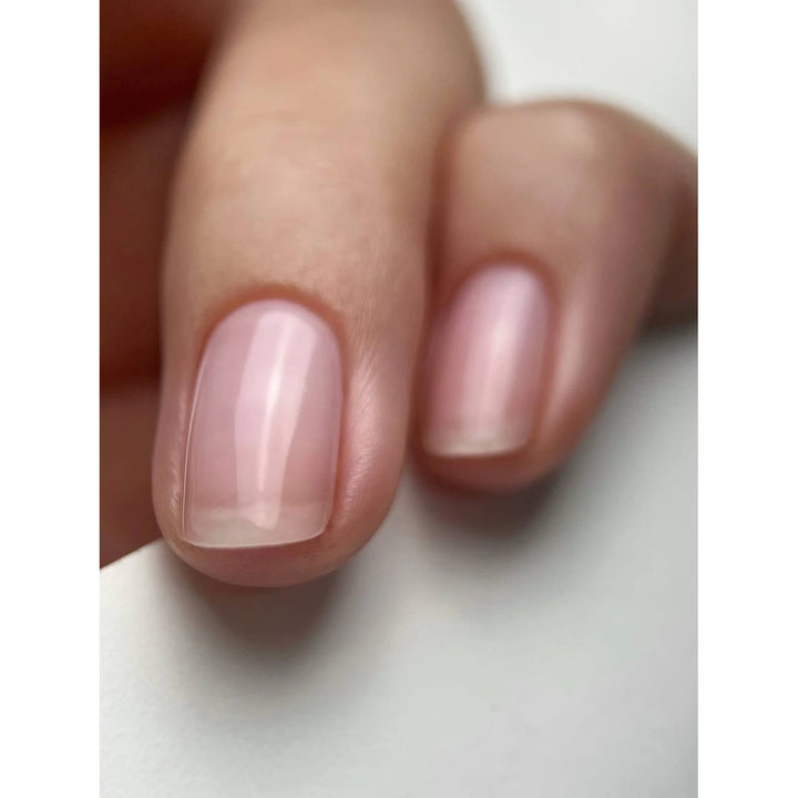 Natural short nails with glossy nude pink gel polish, perfect for manicure inspiration