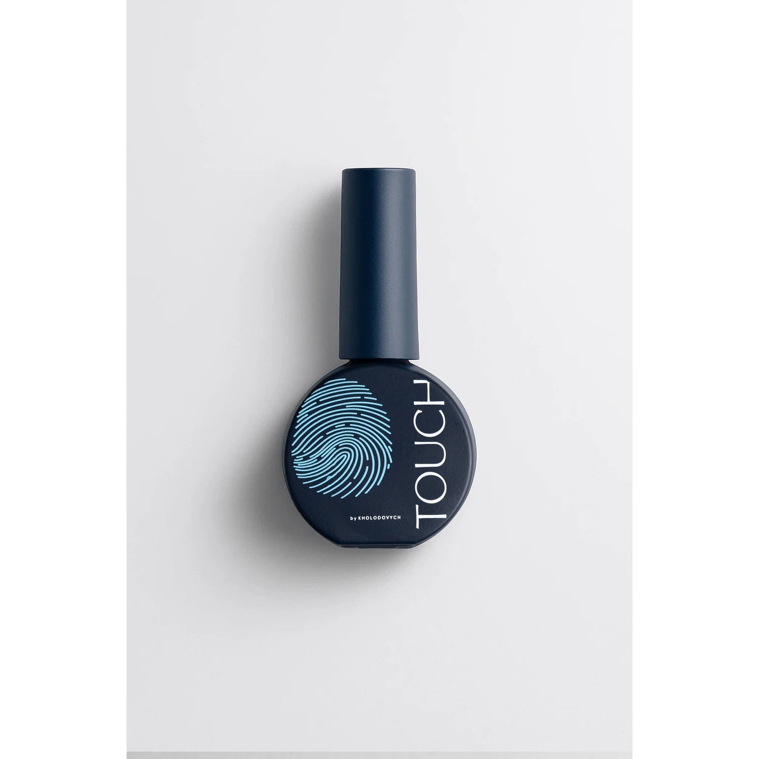 Dark blue gel nail polish bottle with blue fingerprint design and 'TOUCH' text on white background