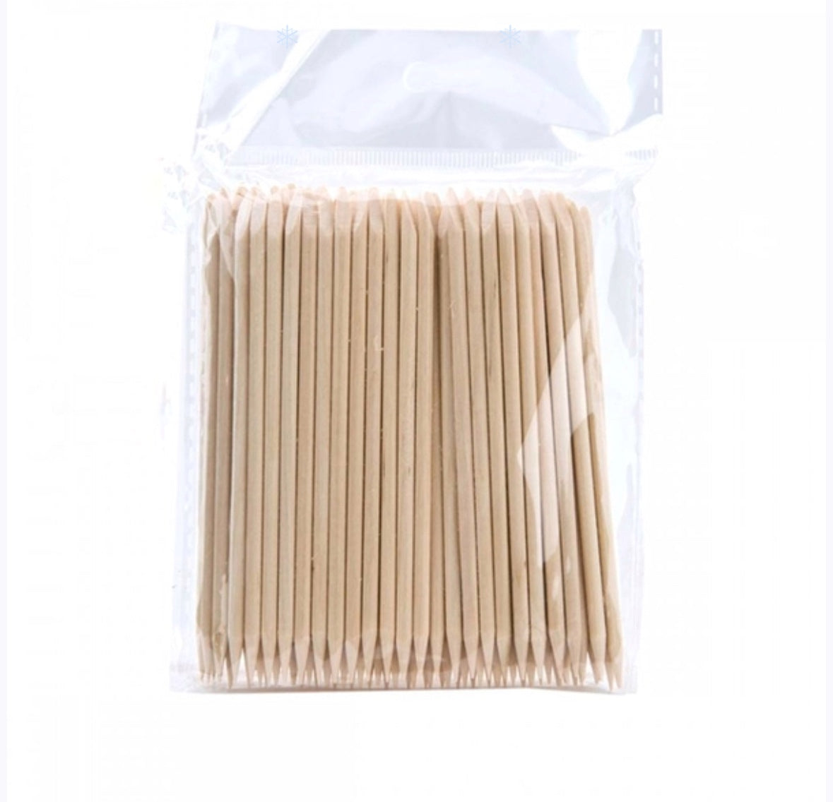 Pack of wooden cuticle sticks for manicure and nail care, sealed in clear plastic bag