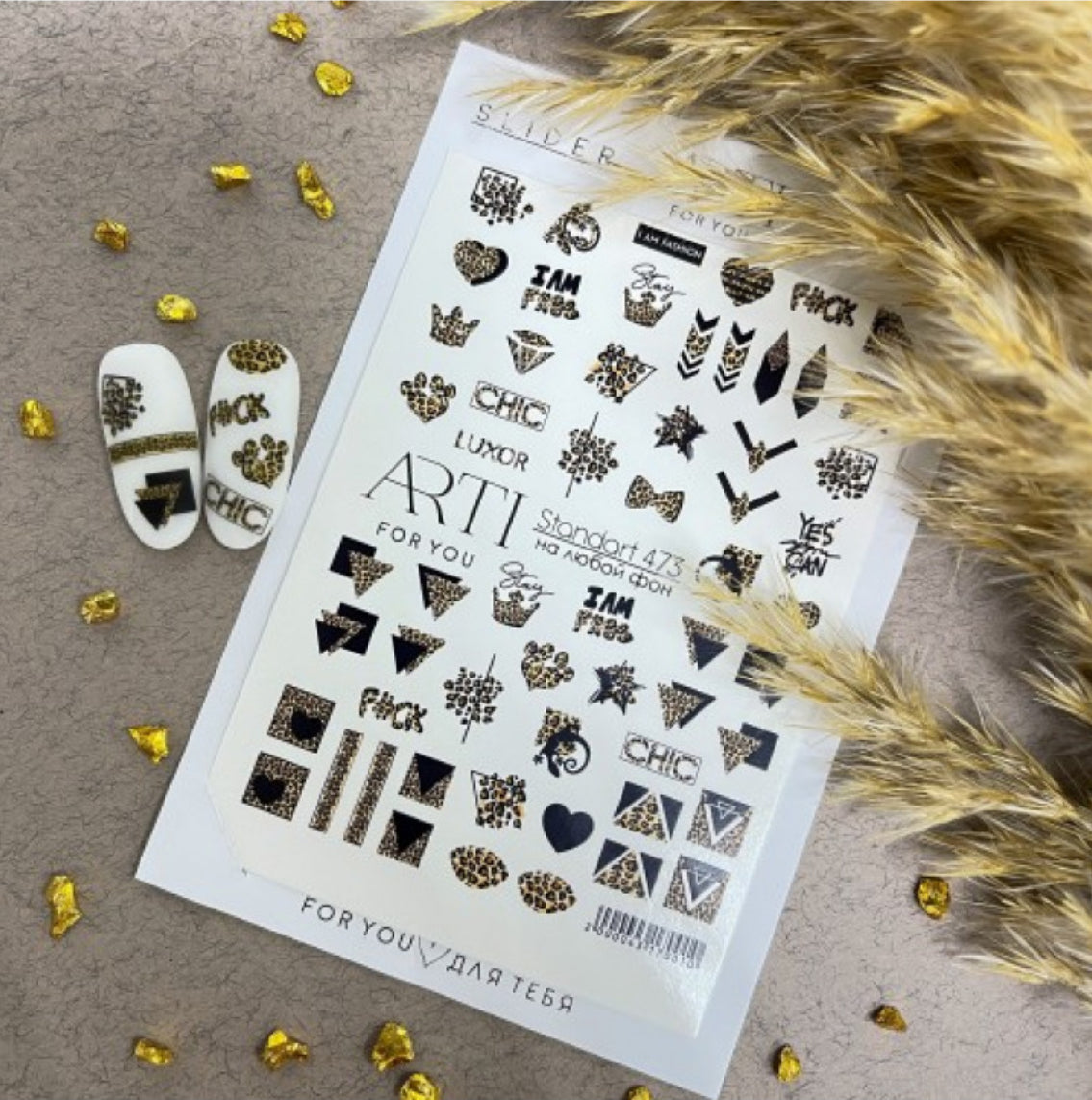 Leopard print nail art stickers sheet with decorated sample nails and gold accents.