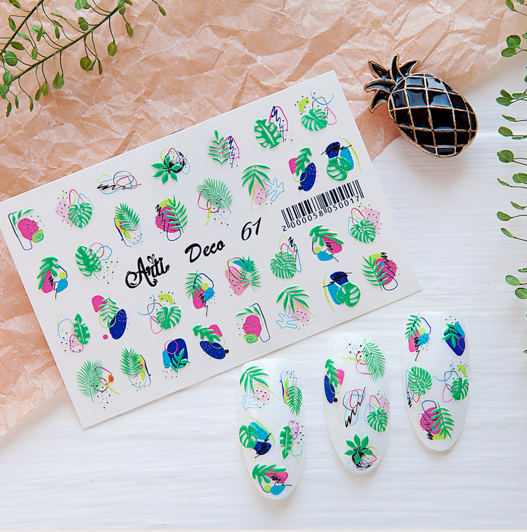 Tropical nail art stickers with colorful leaves, fruits, and abstract designs on a display card.
