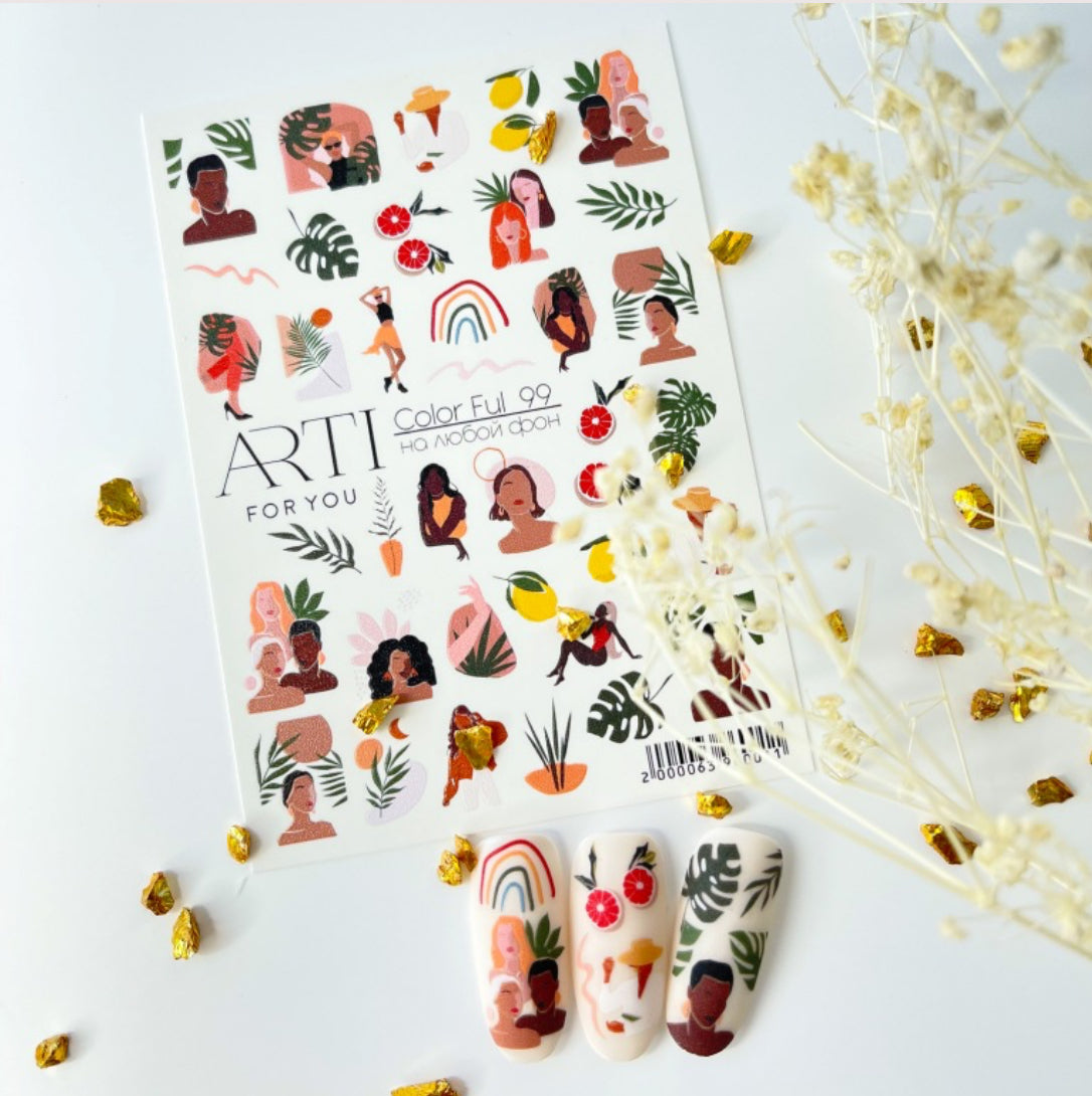Nail art sticker sheet with diverse female portraits, fruits, and tropical leaves, displayed with decorated nail tips.